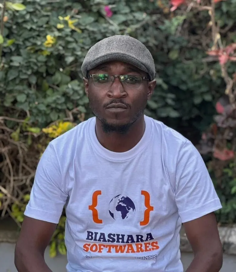 Luke Tsalwa wearing a Biashara Softwares t-shirt